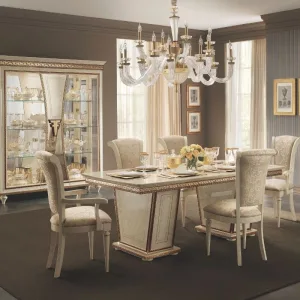 Fantino dining room with china cabinet behind it from French Furniture.