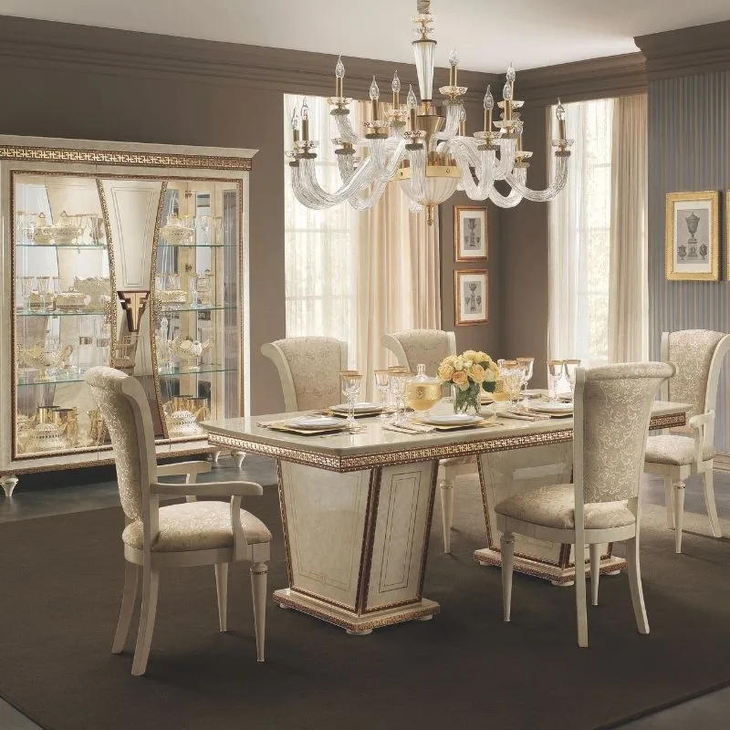 Fantino dining room with china cabinet behind it from French Furniture.